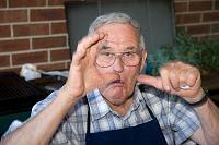  Grandad, offering tips on how to hold the camera
